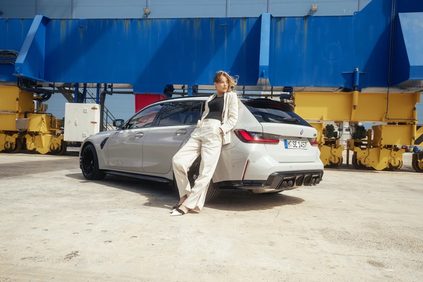 A model and the first-ever BMW M3 Touring