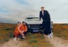 Lee Foss & Ralf pose by a Cadillac
